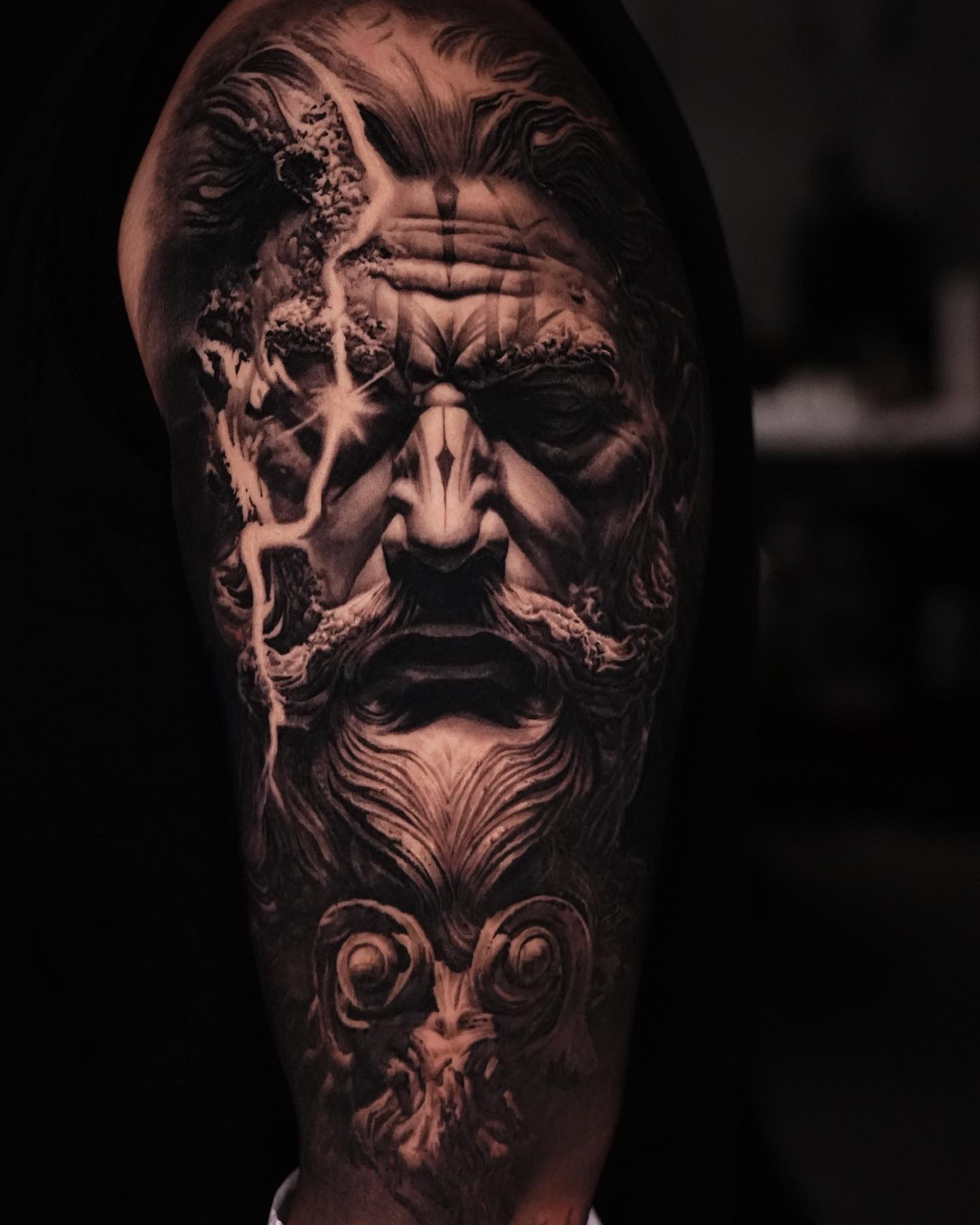 Abstract face realism tattoo on the forearm by Black and Grey Tattoo Artist Umzii