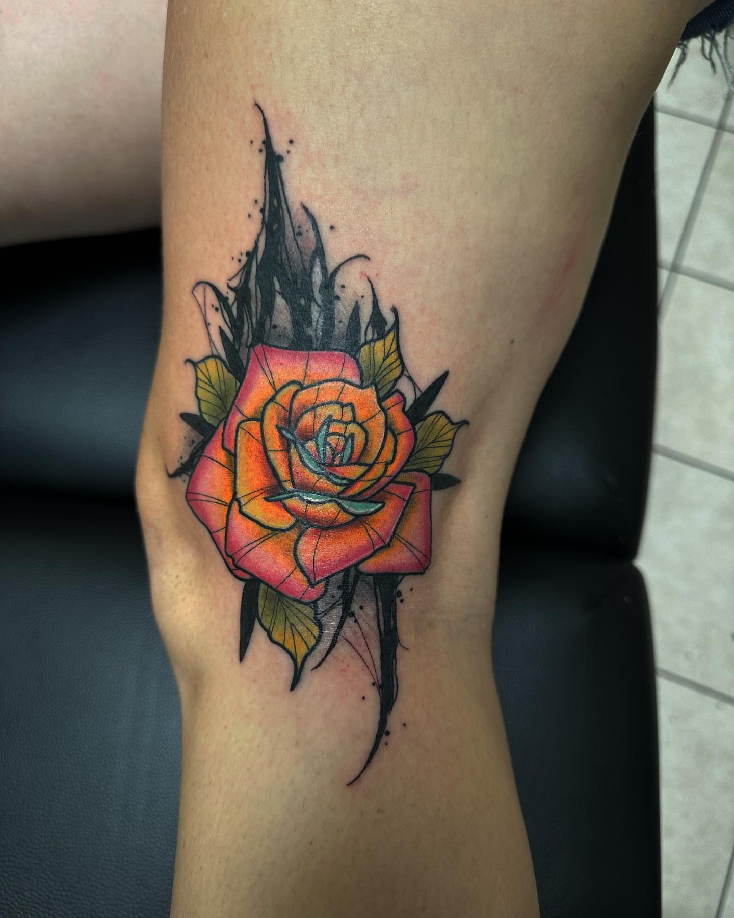 Rose American traditional tattoo on the thigh by duffs, San Marcos, California