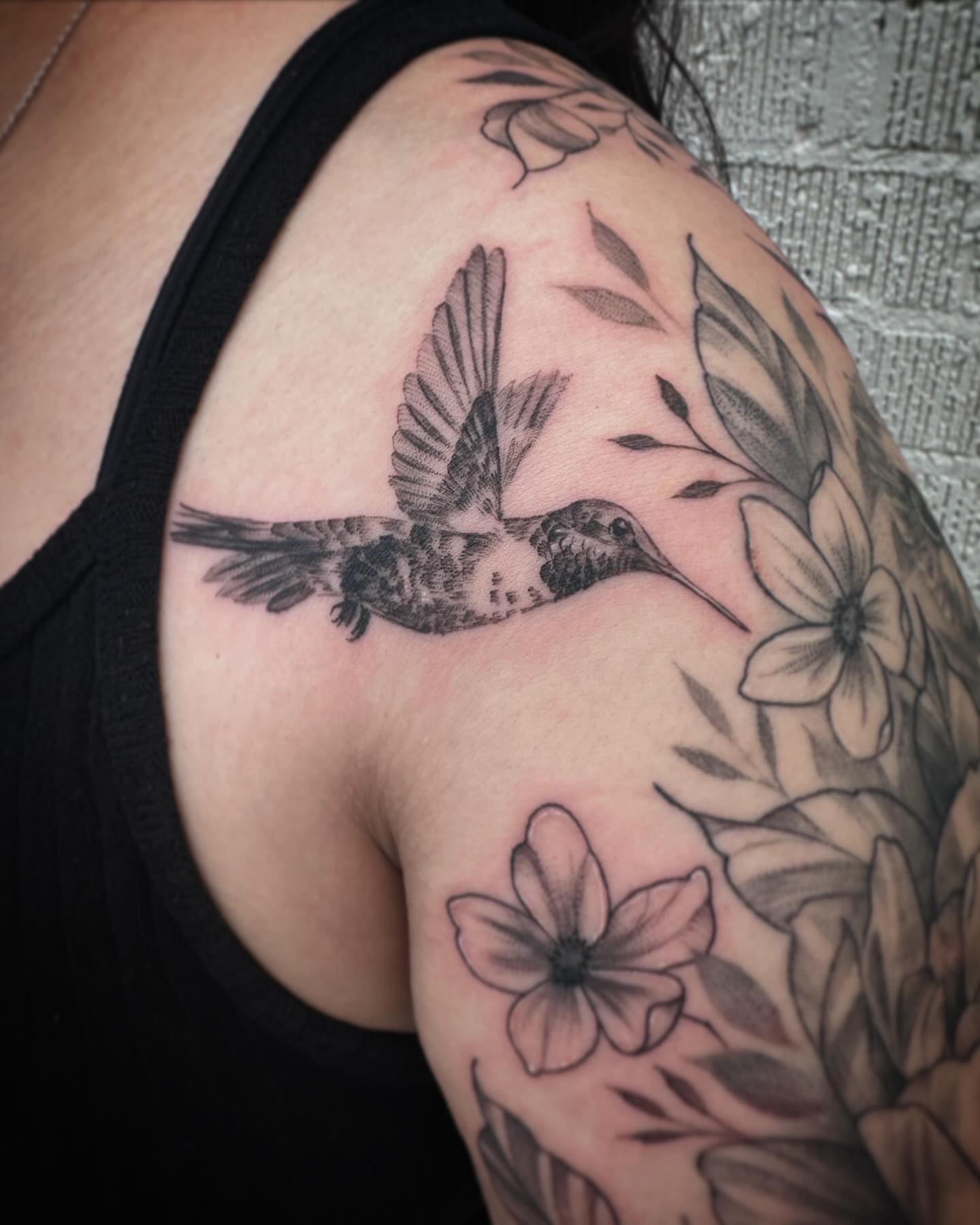 Hummingbird and flowers realism tattoo on the shoulder by Stephanie Shortsleeve