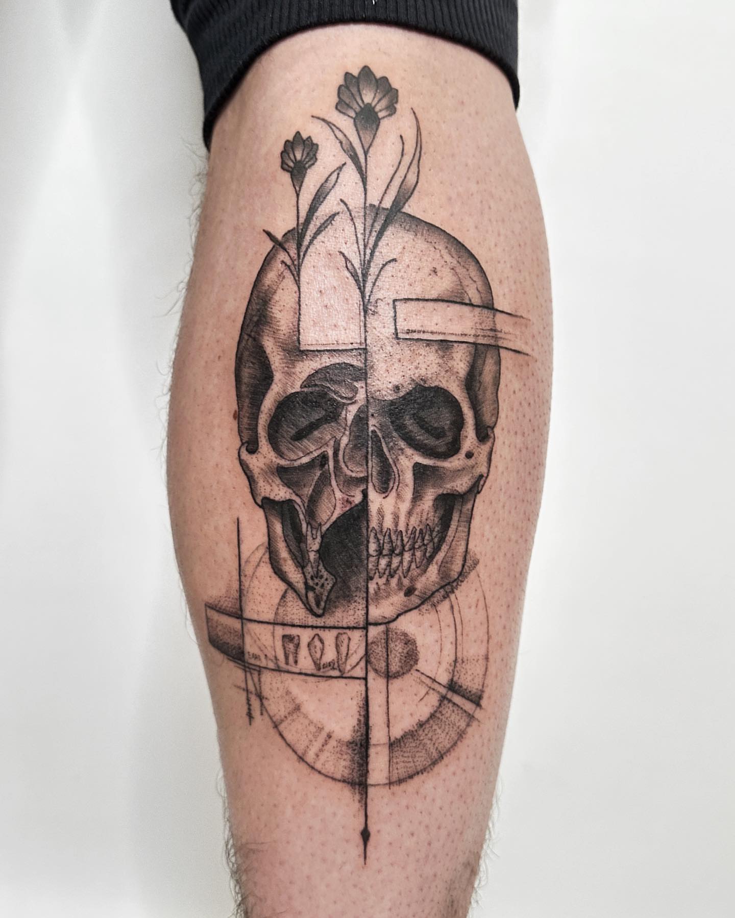 Skull and flowers geometric tattoo on the calf by ๐ฌ๐๐๐๐๐๐ ๐ฟ๐๐๐๐๐๐, Dickson, Tennessee