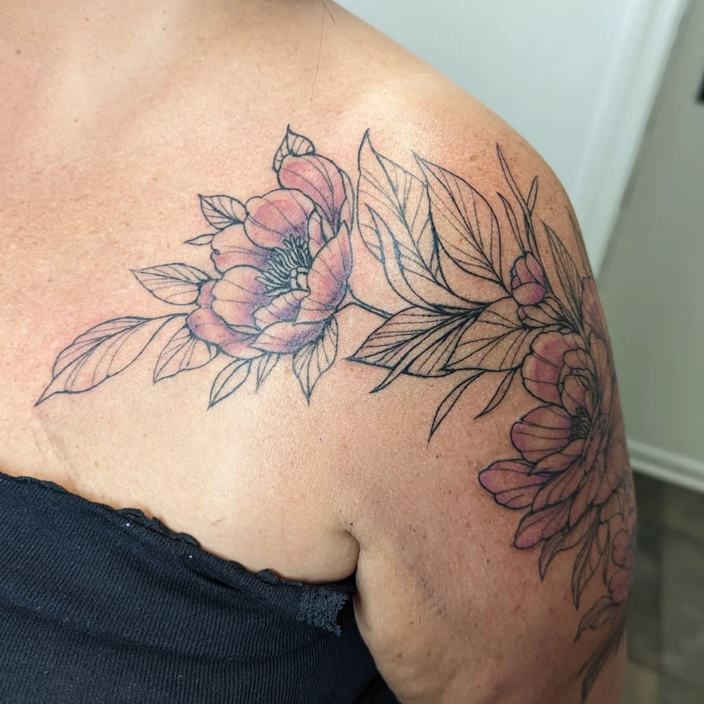 Peony flowers black and grey tattoo on the shoulder by Lorelei