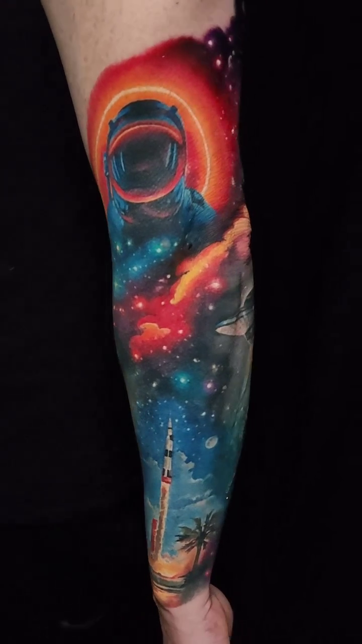 Astronaut and rocket realism tattoo by Tyler Malek