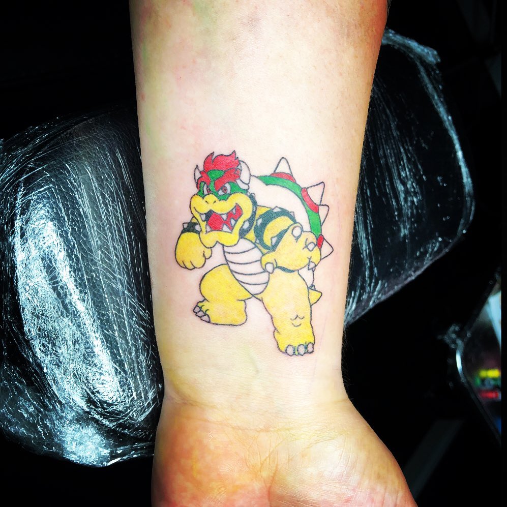 Bowser new school tattoo on the forearm by Tattoos by Marcy