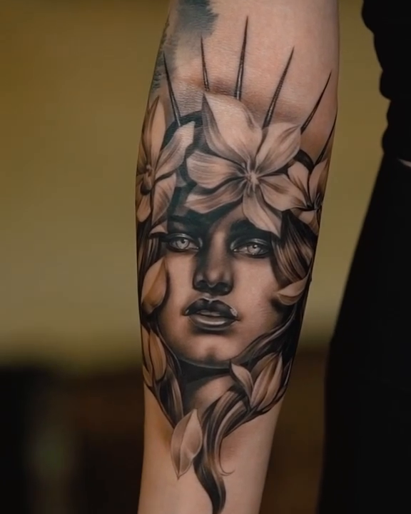 Portrait of a woman with flowers realism tattoo by Anthony Michaels, Tucson, Arizona