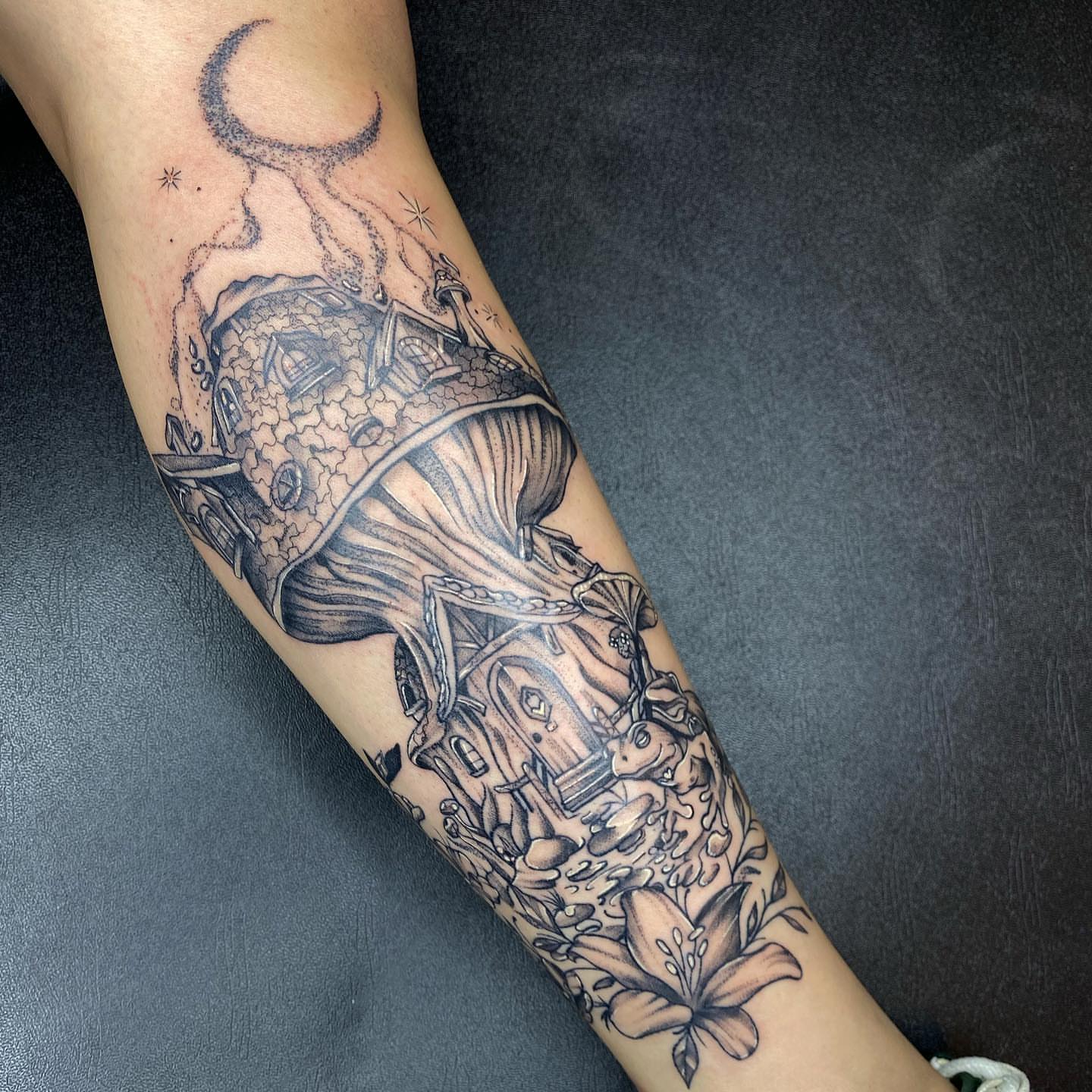 House and flowers realism tattoo on the forearm by Maddie Neibert