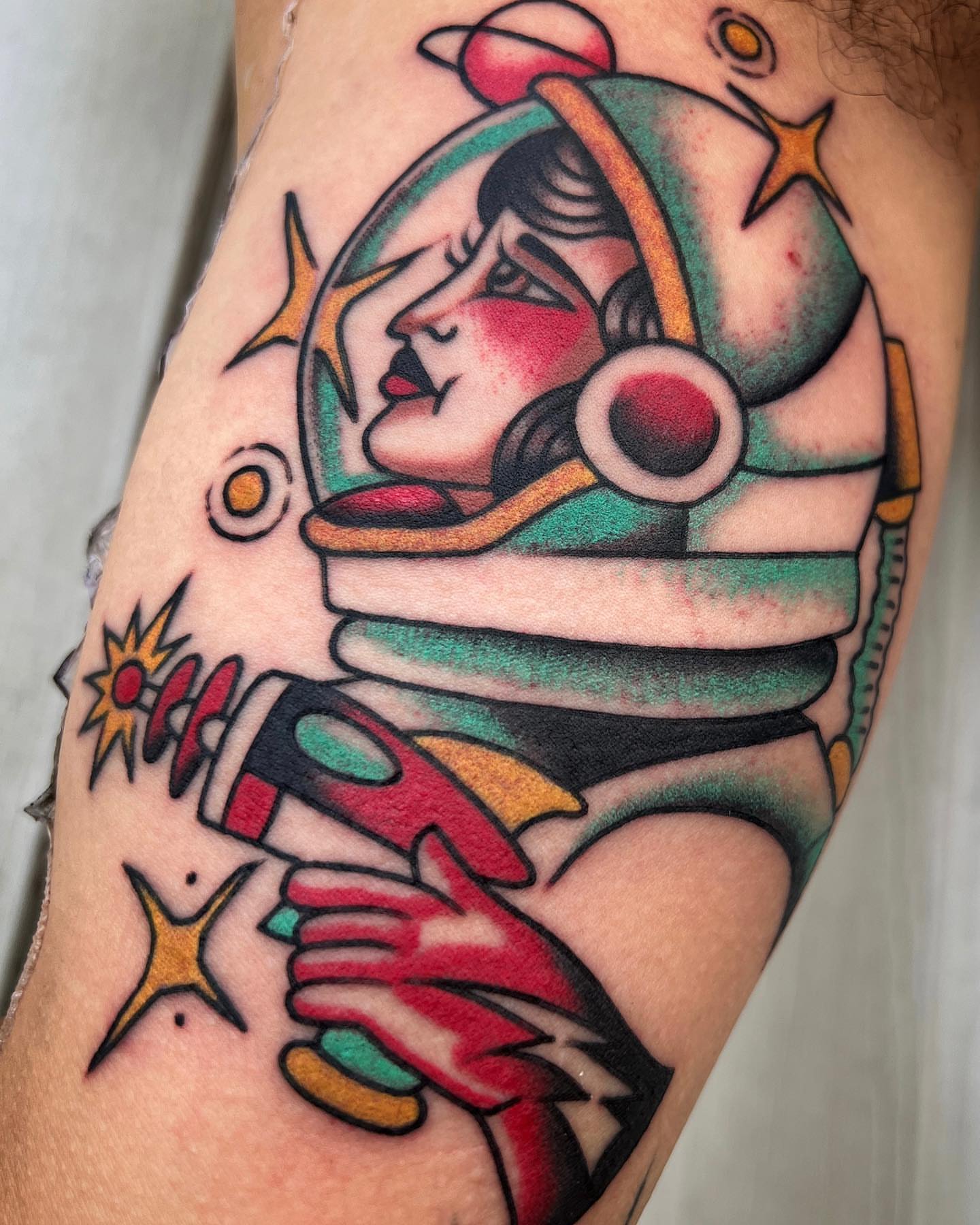 Astronaut American traditional tattoo on the forearm by Daniel Mesen