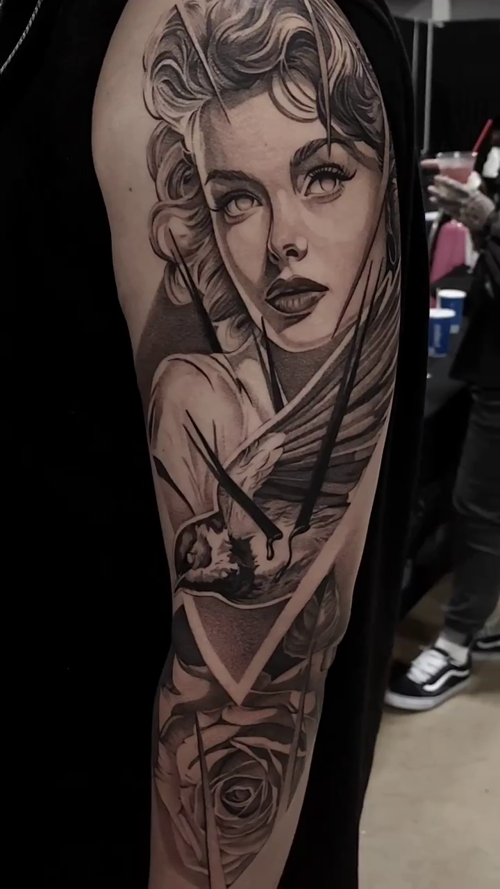 Woman and bird realism tattoo by Ana Fajardo