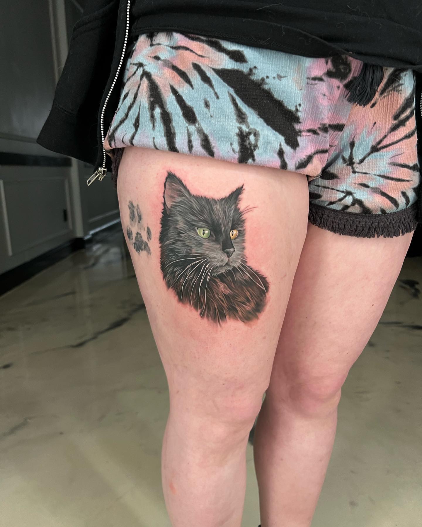 Cat realism tattoo on the thigh by Derek Gardner