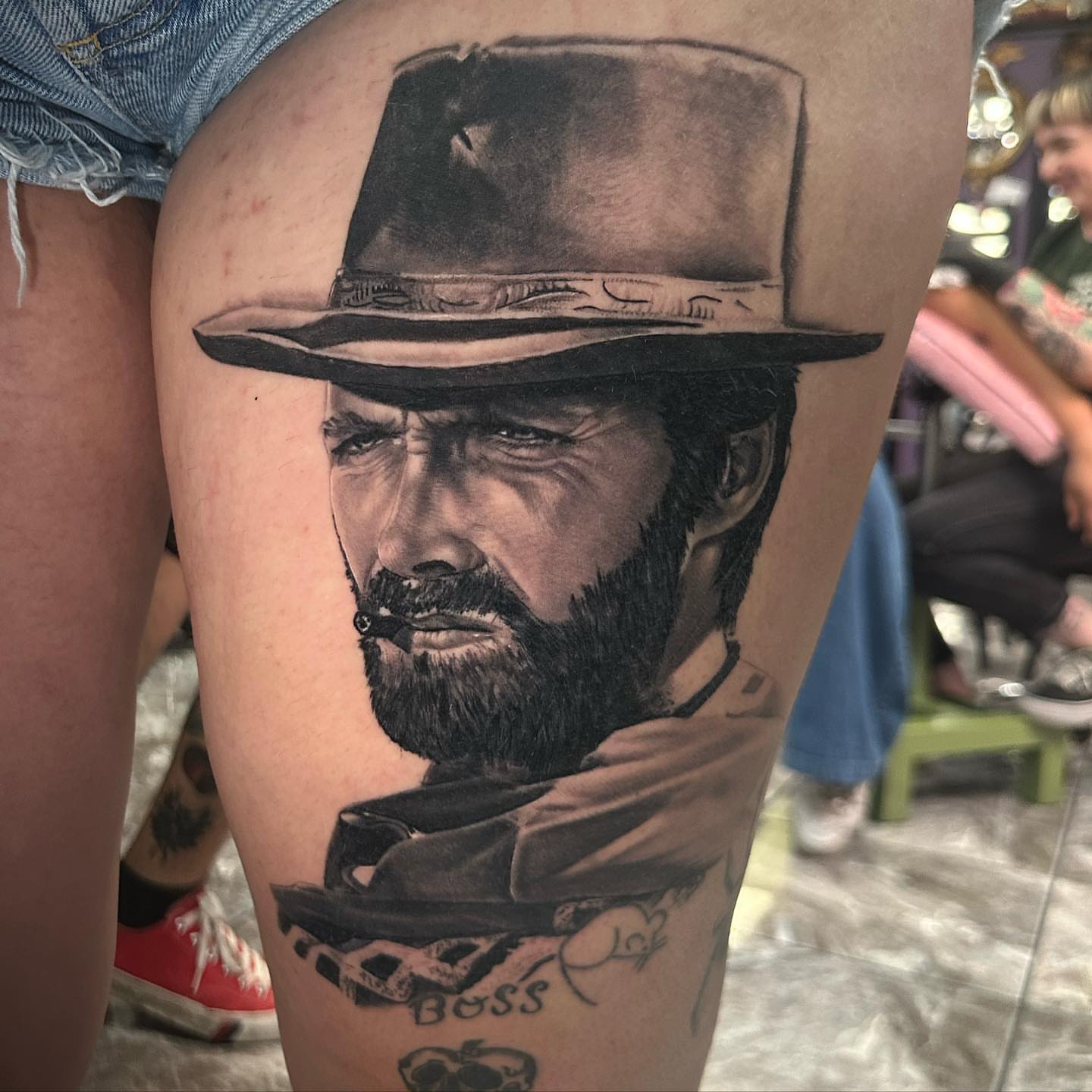 Clint Eastwood realism tattoo on the thigh by Billy Harris
