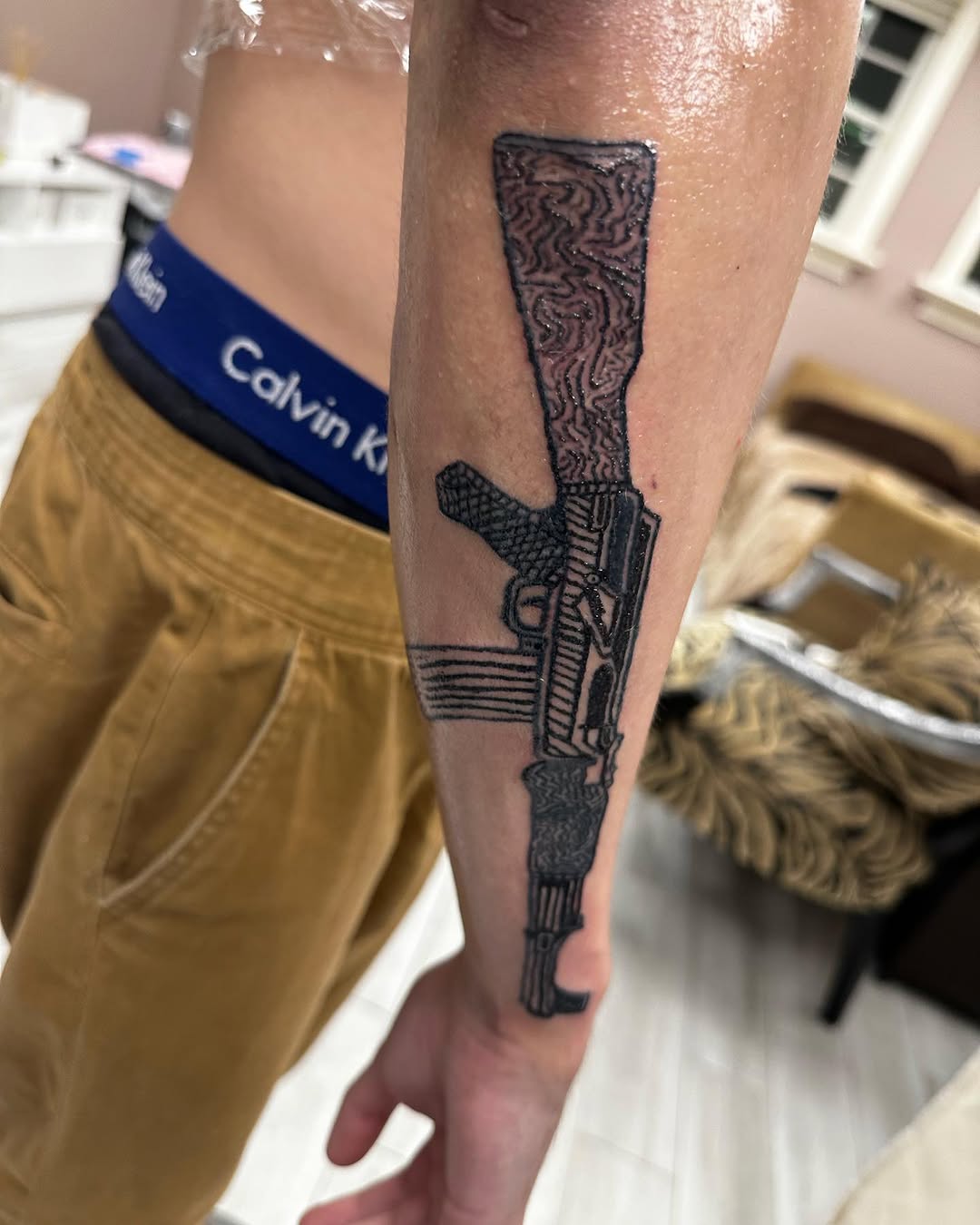 AK-47 rifle tattoo on the forearm by Silky Inks NJ 201, North Haledon, New Jersey