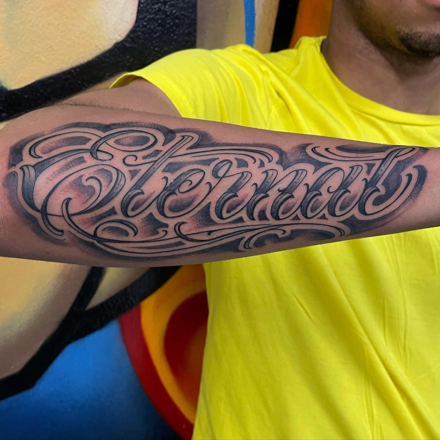 Eternal lettering script tattoo on the forearm by Manny