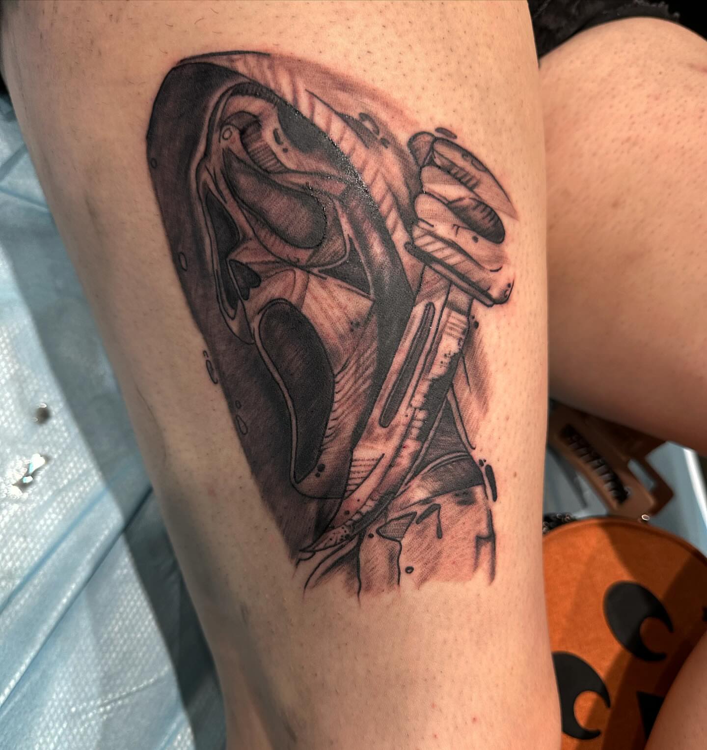 Mask and gun geometric tattoo on the forearm by Cyko Hernandez