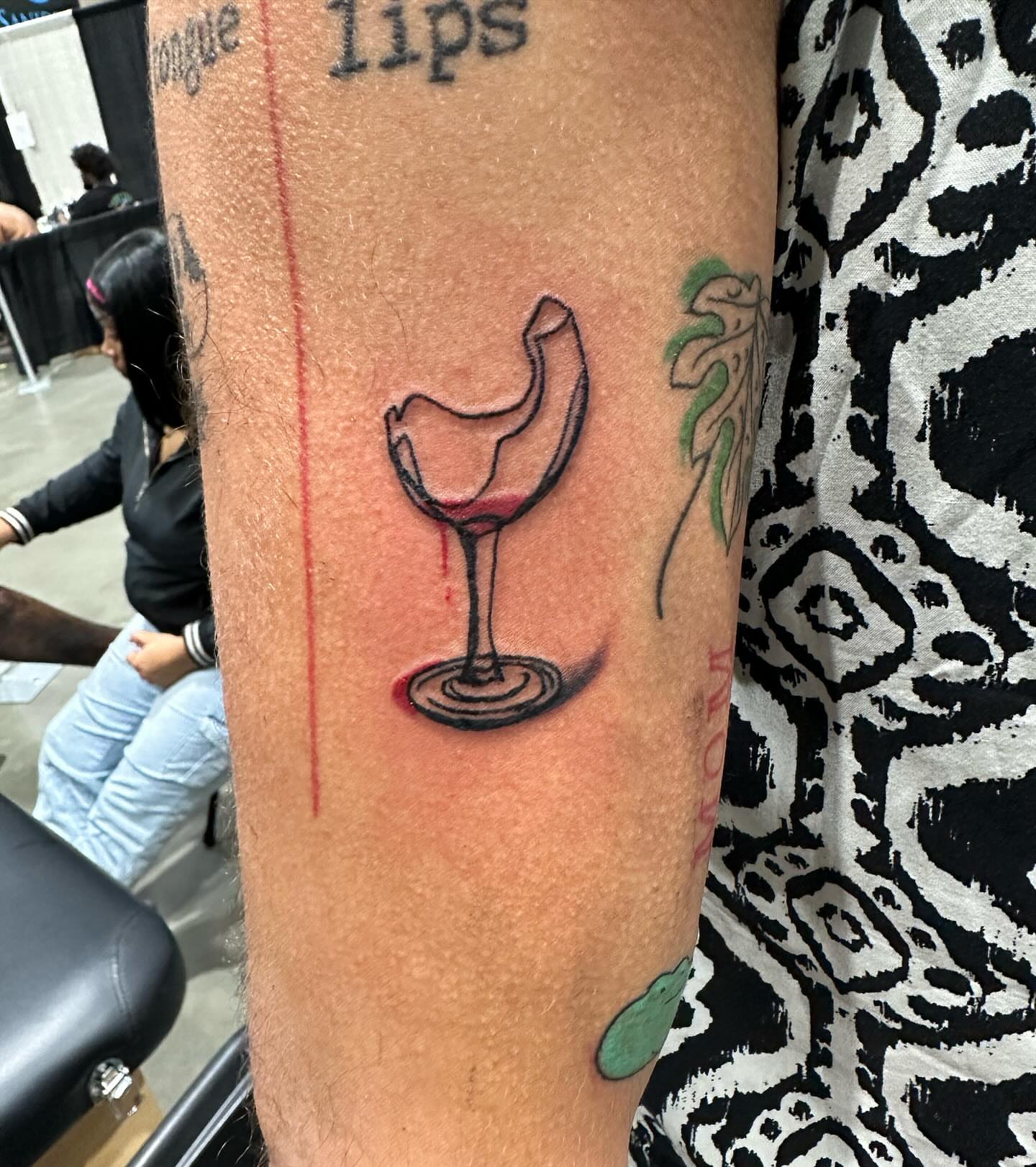 Wine glass realism tattoo on the forearm by Cyko Hernandez
