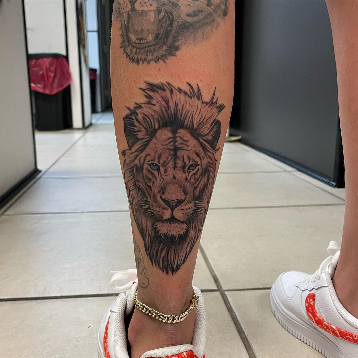 Lion realism tattoo on the calf by Las Vegas Tattoo Artist