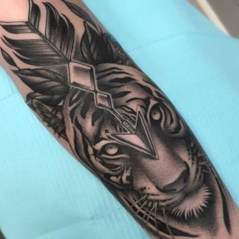 Tiger realism tattoo on the forearm by Alex Rockoff
