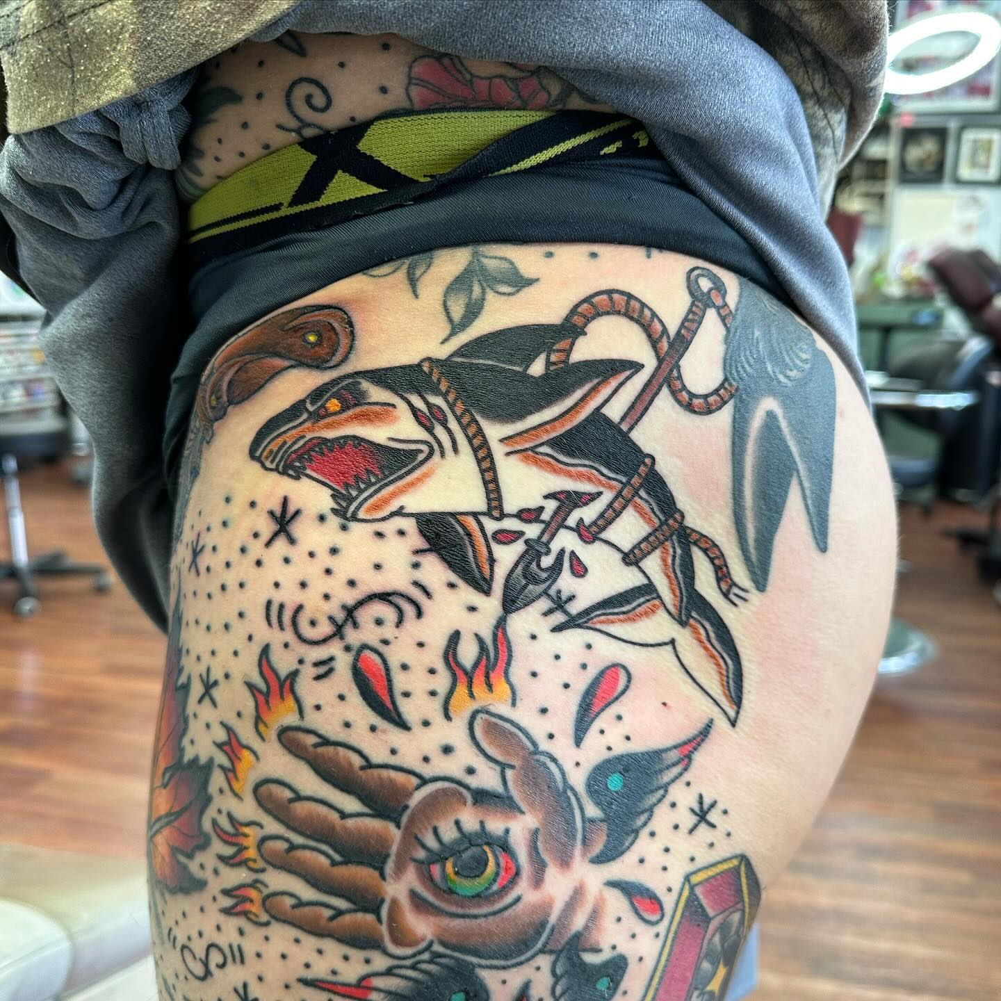 Shark and snake American traditional tattoo on the thigh by Zach Eden
