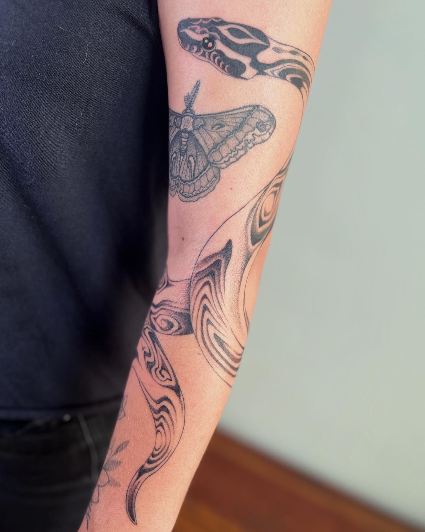 Snake and moth geometric tattoo on the forearm by 👽 Kat 👽, San Francisco, California