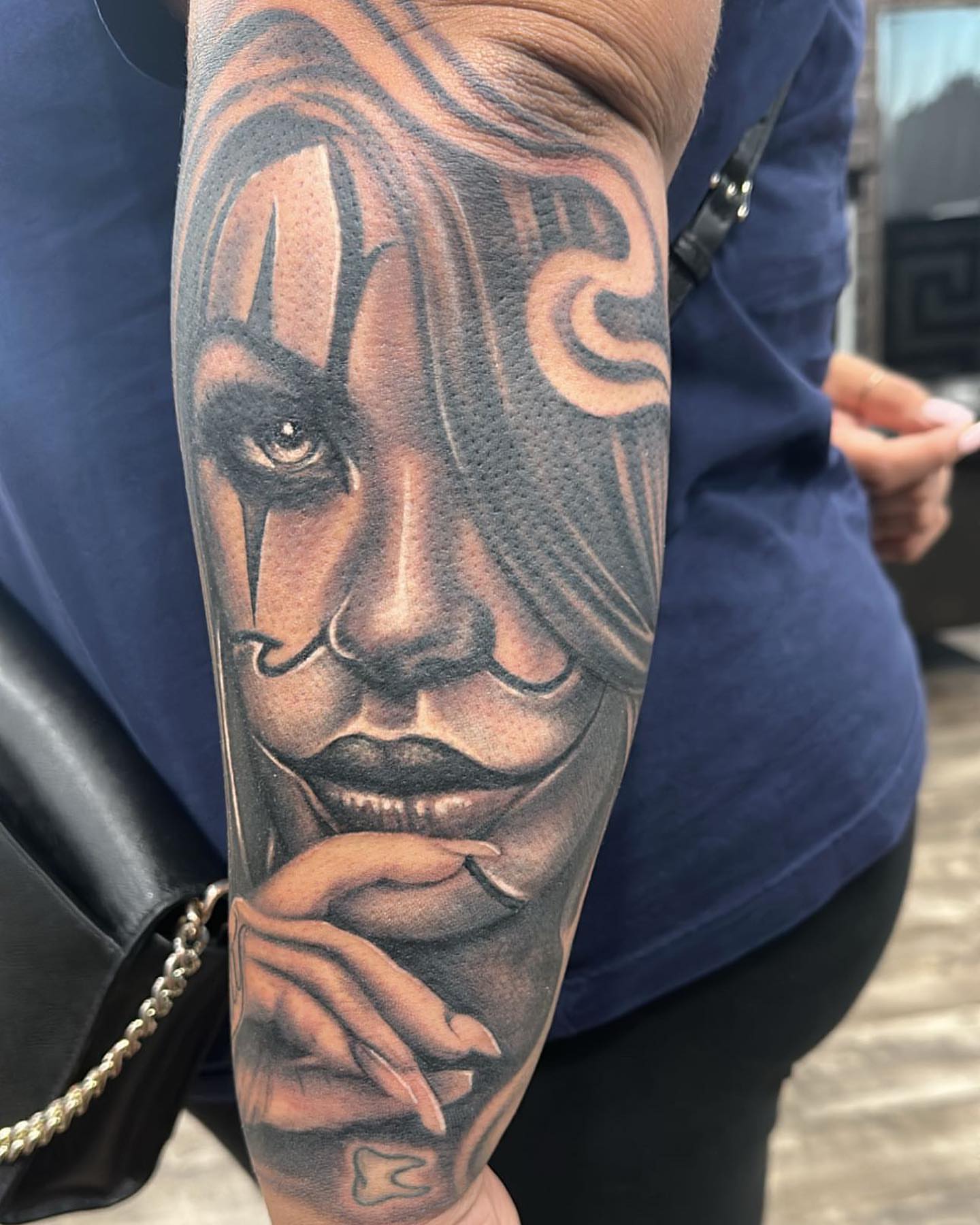 Woman's face realism tattoo on the forearm by WestHustleArt