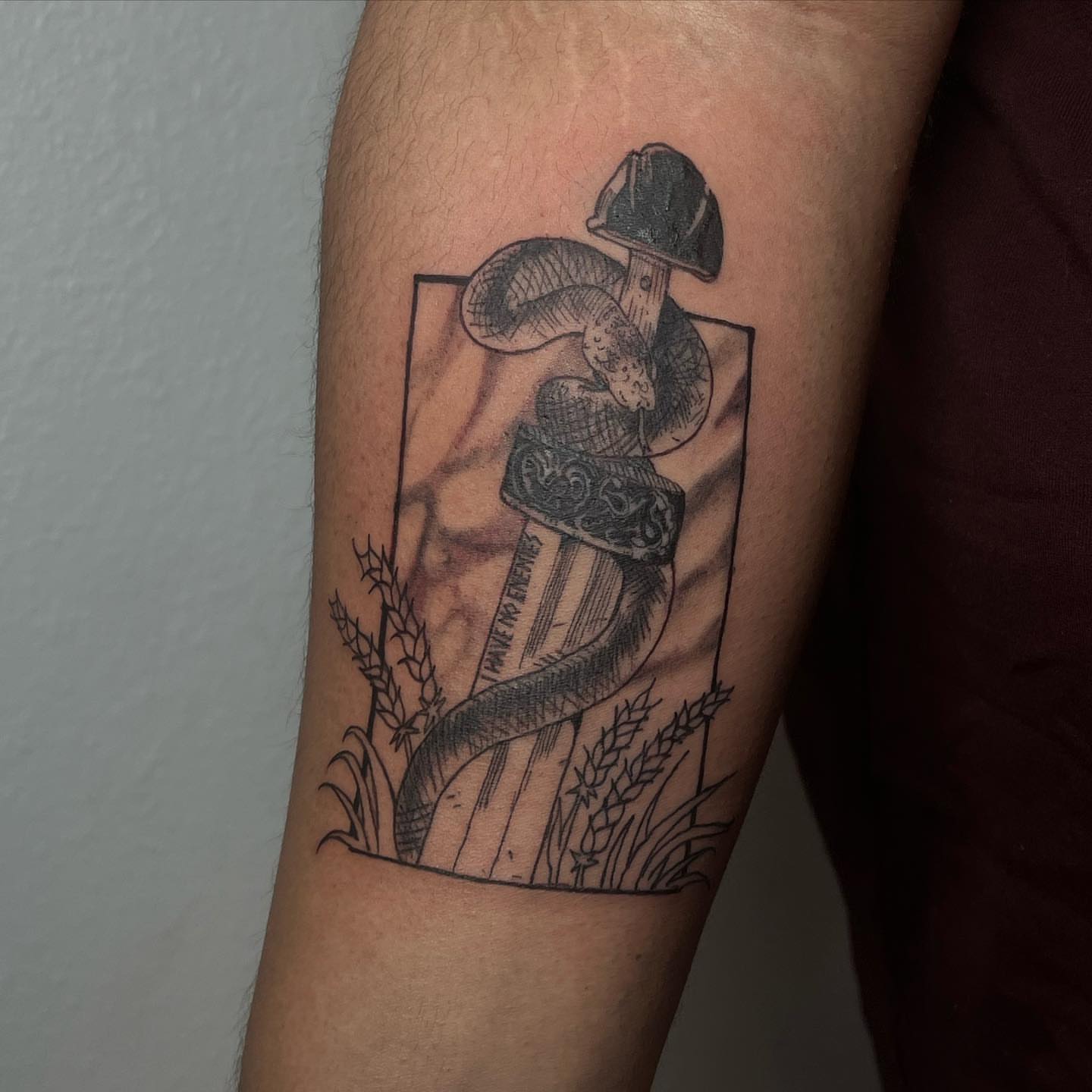 Sword and snake black and grey tattoo on the forearm by josselyn ☪︎