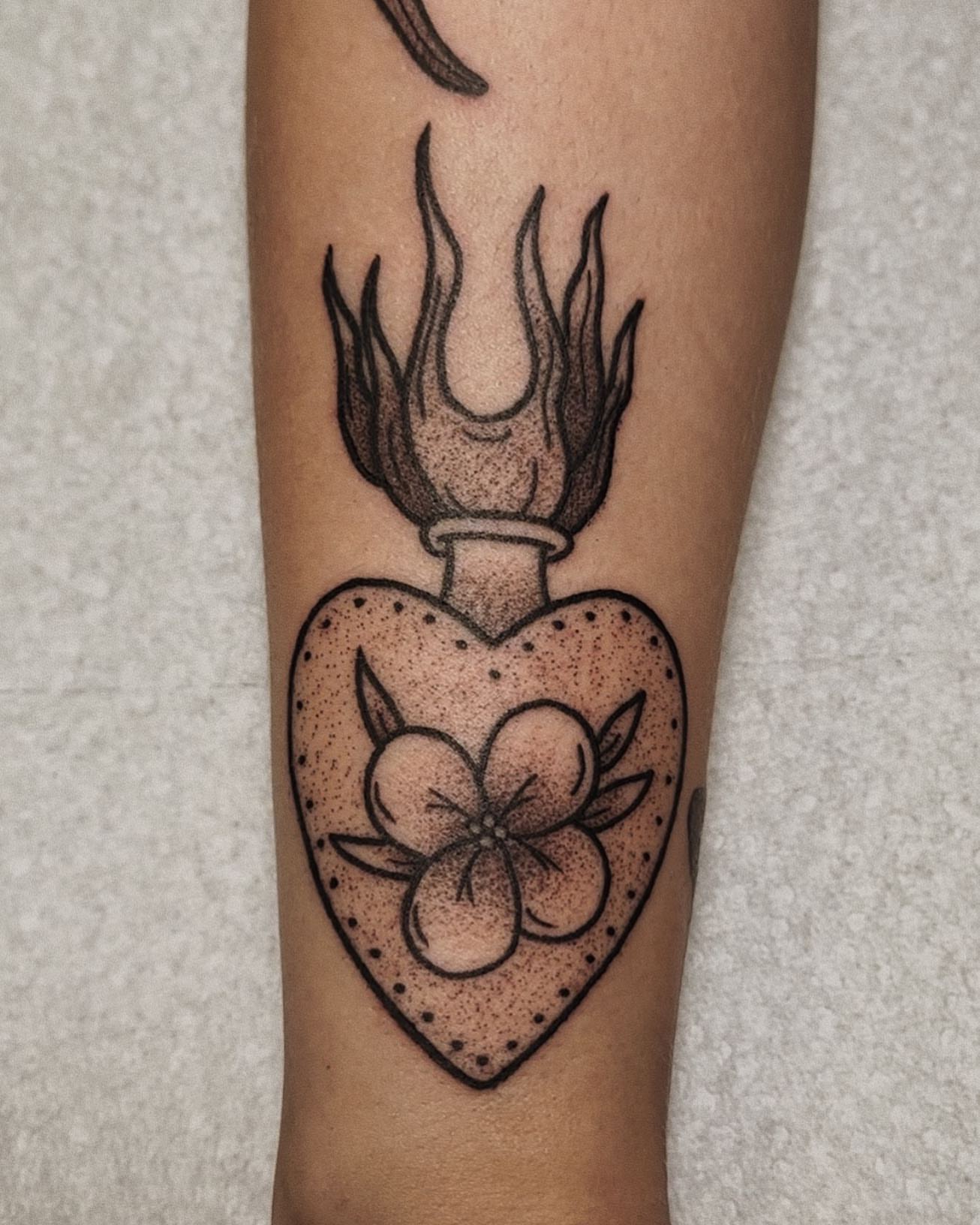 Flame-topped heart with flowers dotwork tattoo on the forearm by savannah ★ ( previously feralratbabe )