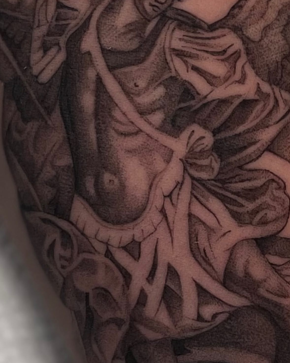 Human anatomy black and grey tattoo on the upper arm by Vanessa Valdivia