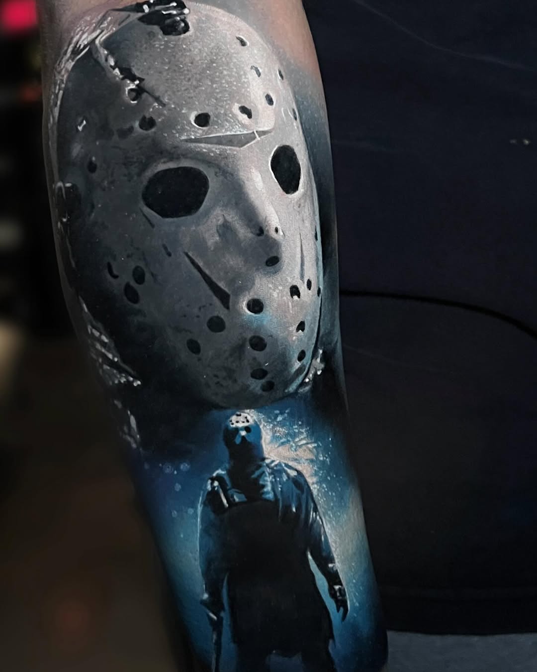 Jason Voorhees mask and figure realism tattoo on the forearm by Alex Moro