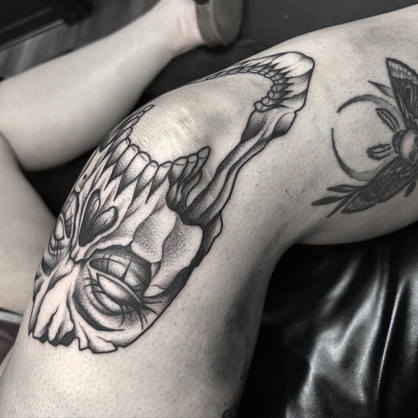 Skull dotwork tattoo on the thigh by Anna Nicole Thomas