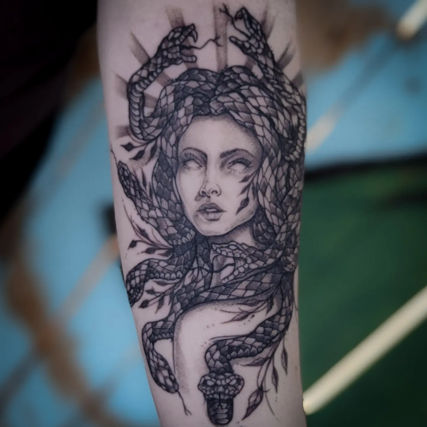 Woman with snakes realism tattoo on the forearm by Gail Howard Perry III