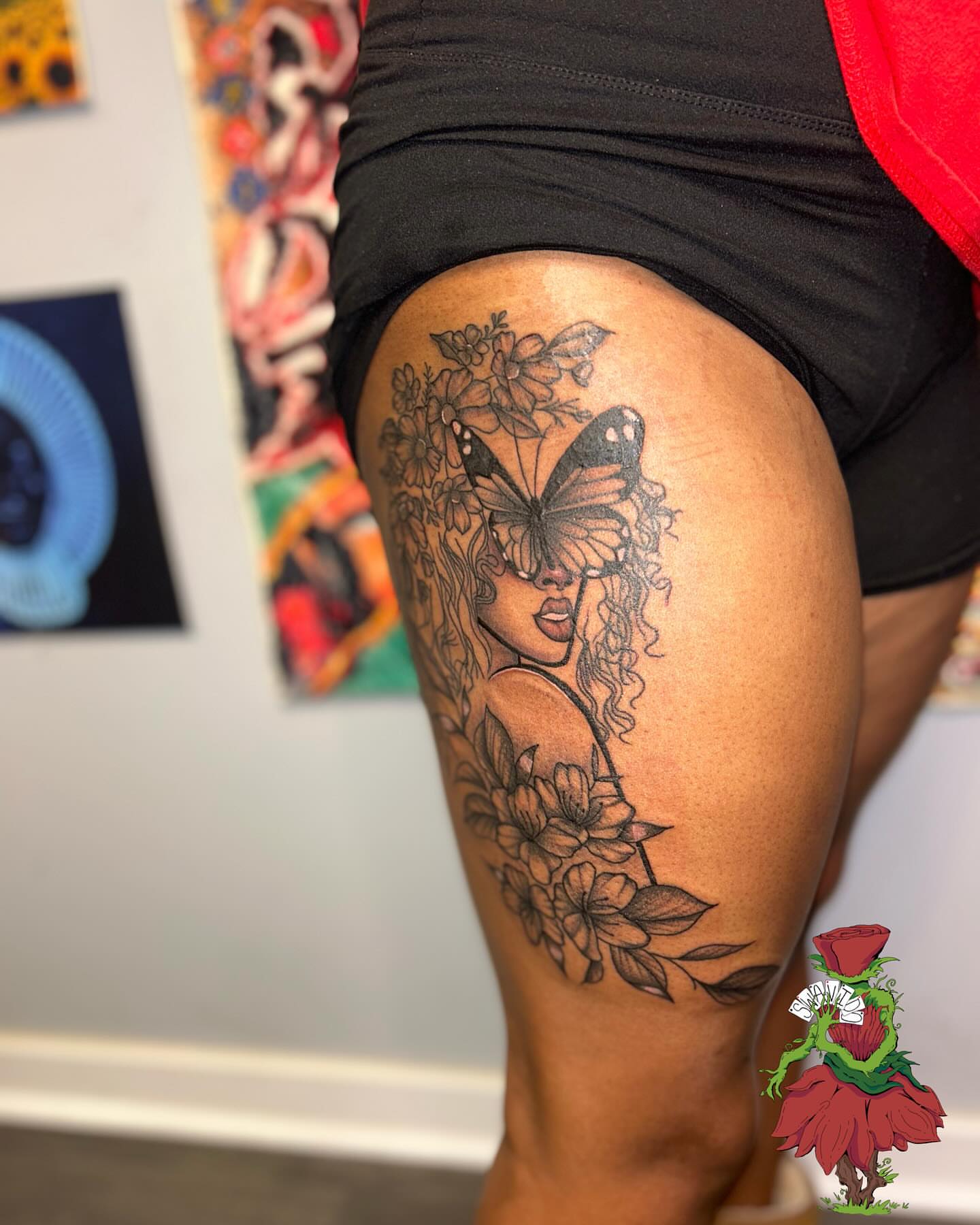 Woman with butterfly black and grey tattoo on the thigh by Marques Neal
