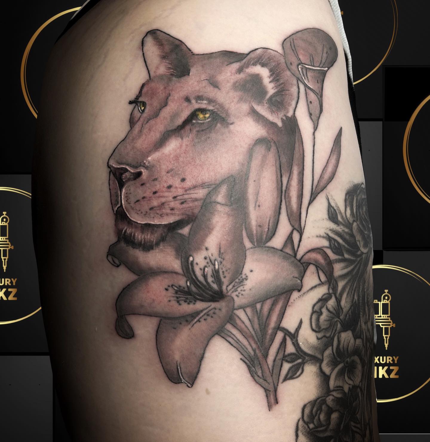 Lion and lilies realism tattoo on the shoulder by Shake_tatts