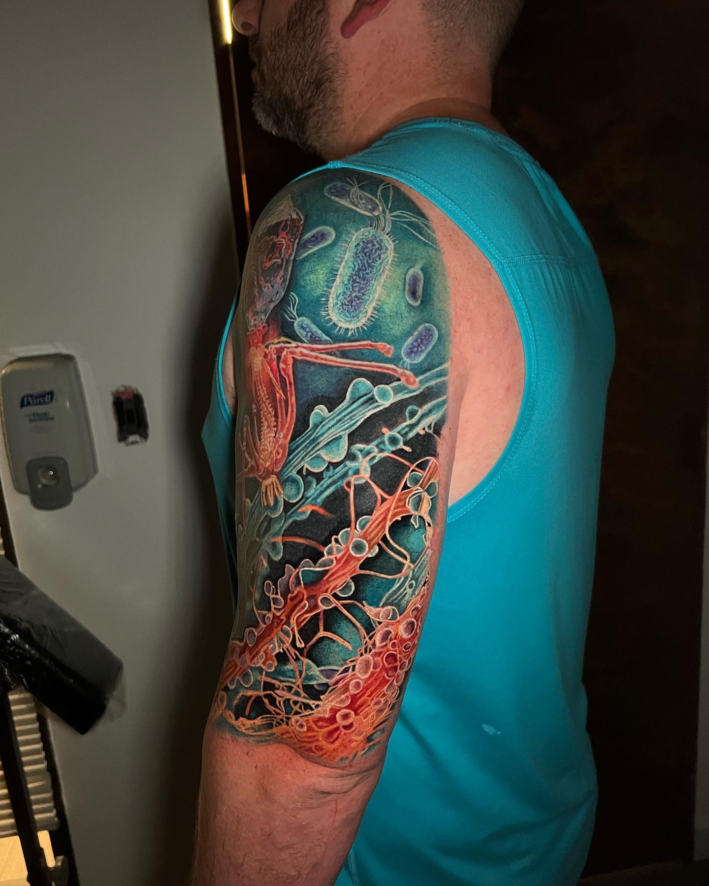 Microscopic organisms realism tattoo on the upper arm by Irina Shapiro, Somerville, Massachusetts