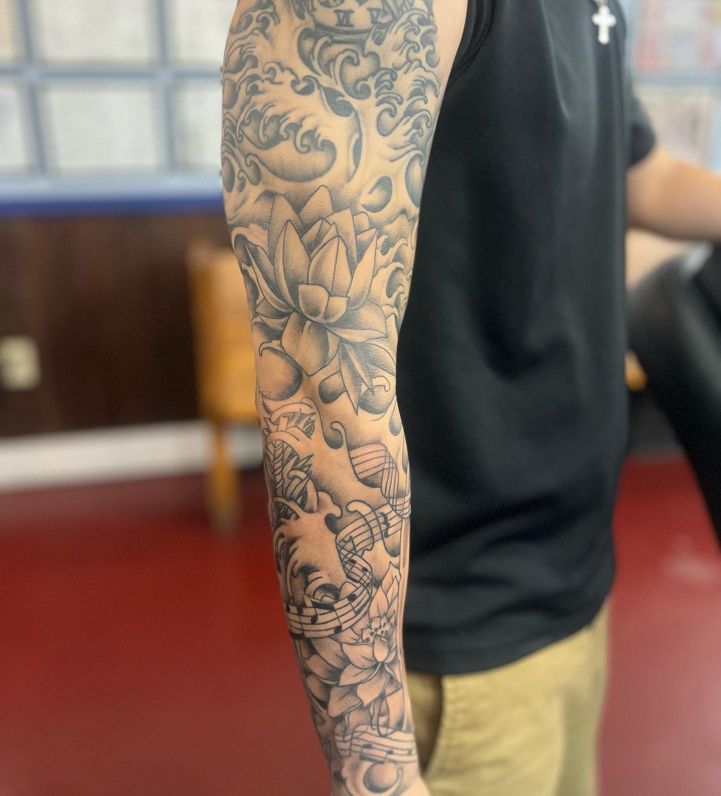 Lotus flower black and grey tattoo on the forearm by IdleHandsFlex, New Orleans, Louisiana