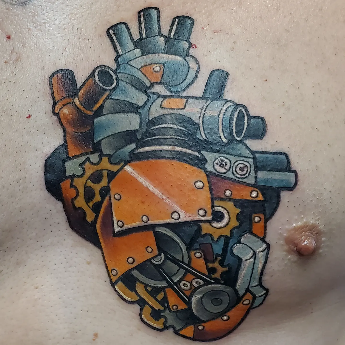 Mechanical heart geometric tattoo on the chest by Brian Savage, Gilbert, Arizona