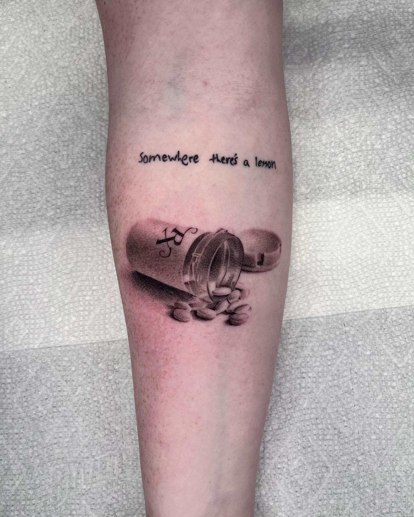 Pill bottle and phrase realism tattoo on the forearm by zach arlan, Kansas City, Missouri