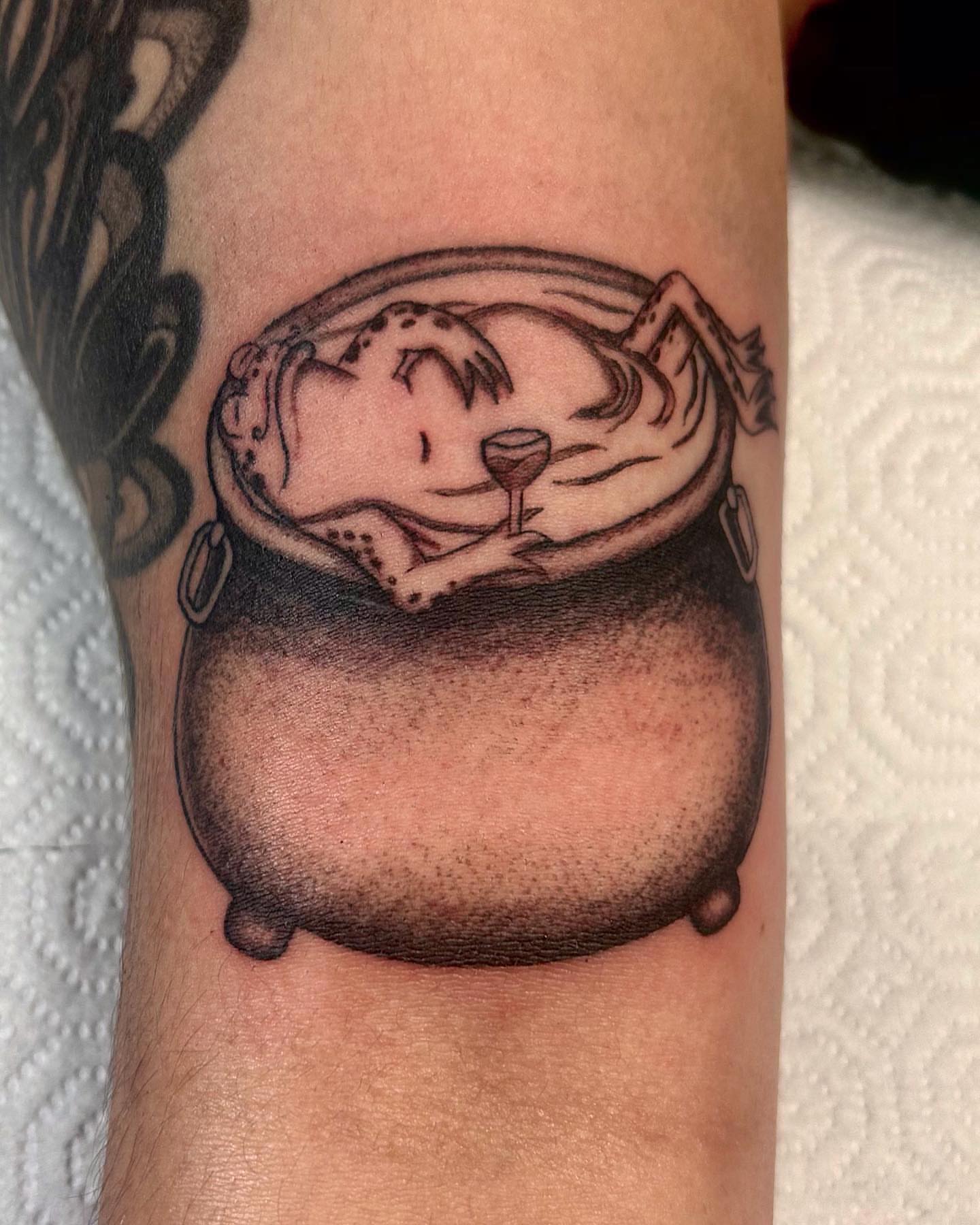 Otter in pot dotwork tattoo on the forearm by Mika