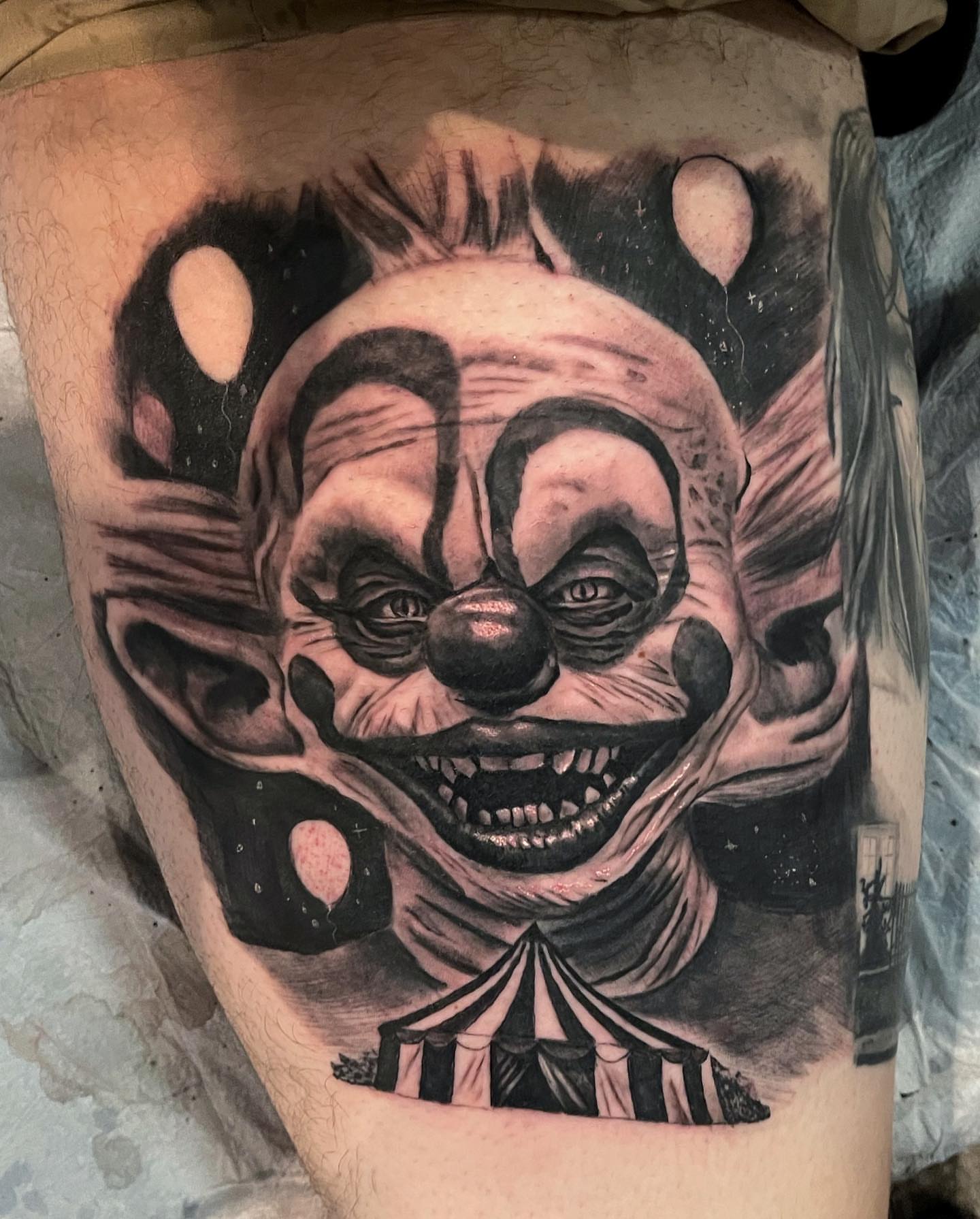 Clown face realism tattoo on the thigh by Antonio Massimino