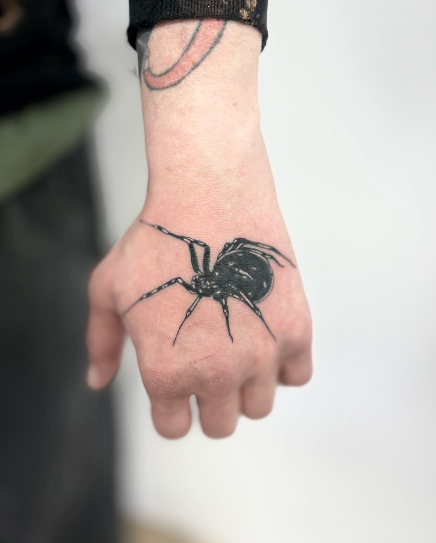 Spider black and grey tattoo on the hand by πππ¦