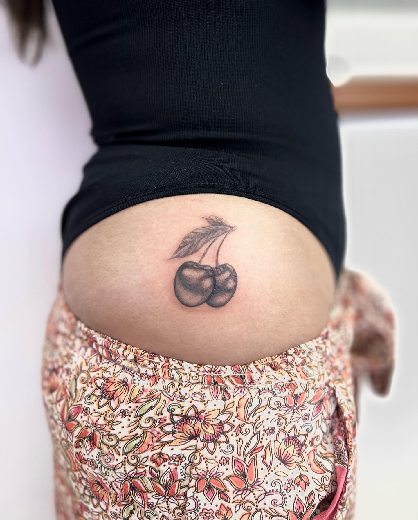 Cherries black and grey tattoo on the thigh by πππ¦