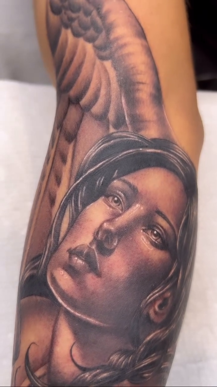 Portrait of a woman with wings realism tattoo by Bailey Hancock