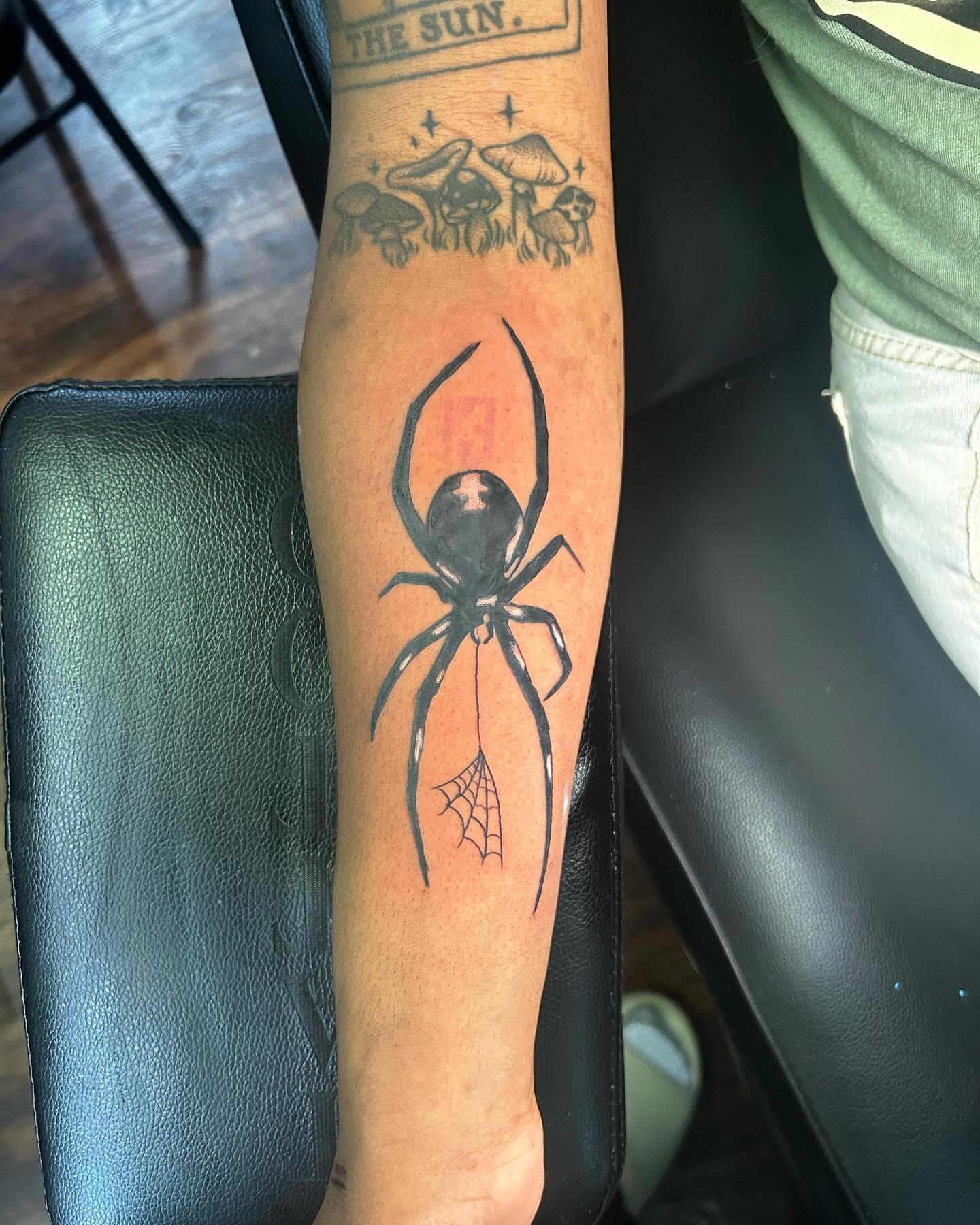 Spider black and grey tattoo on the forearm by Anthony Washington, Atlanta, Georgia