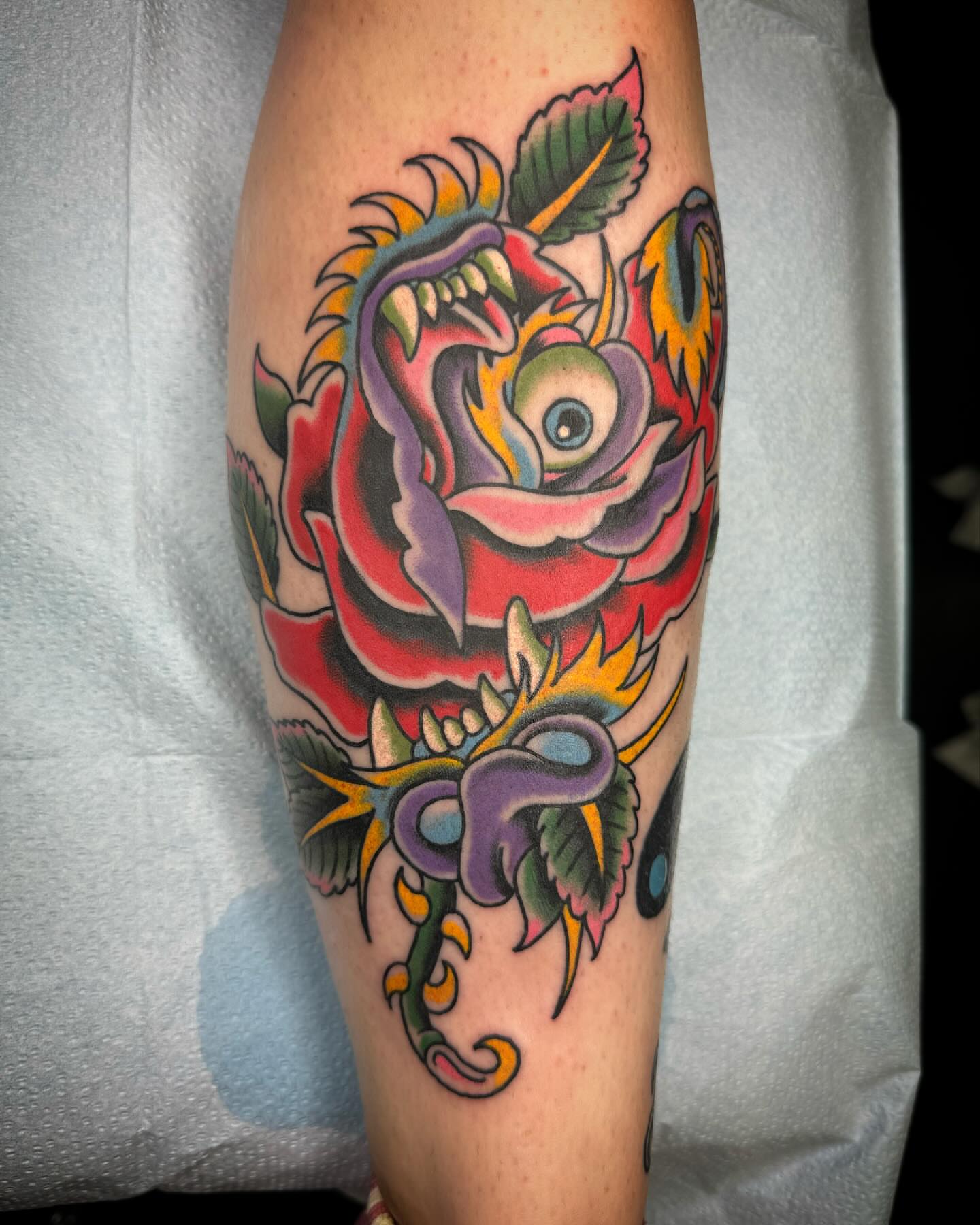 Rose and dragon American traditional tattoo on the forearm by Timothy Wood