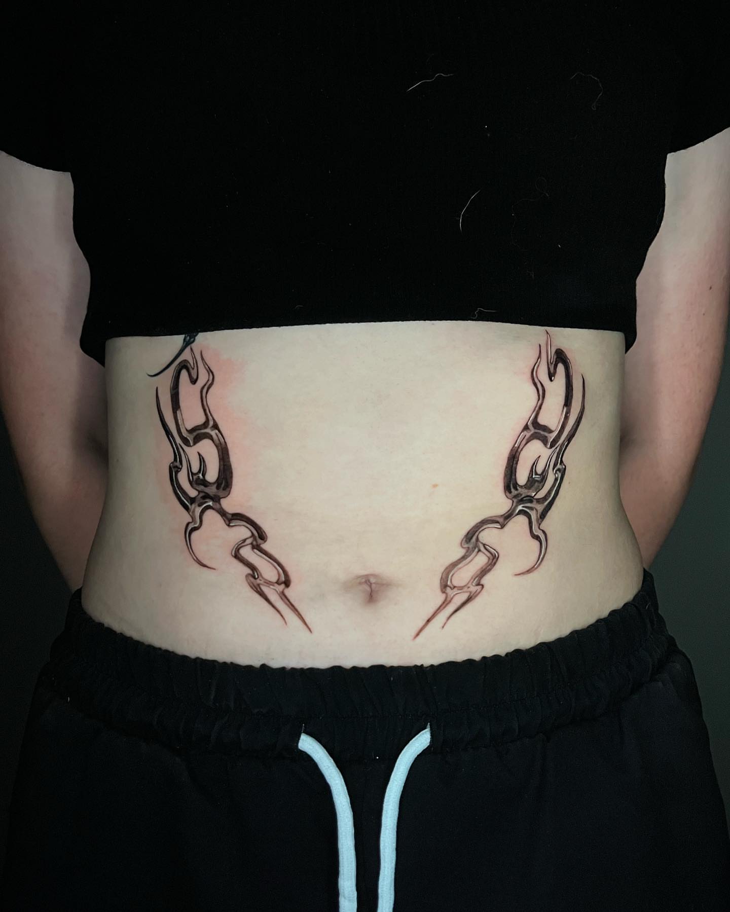 Chains tribal tattoo on the torso by Anthony “Jiinky” Quintanilla 🧸☁️
