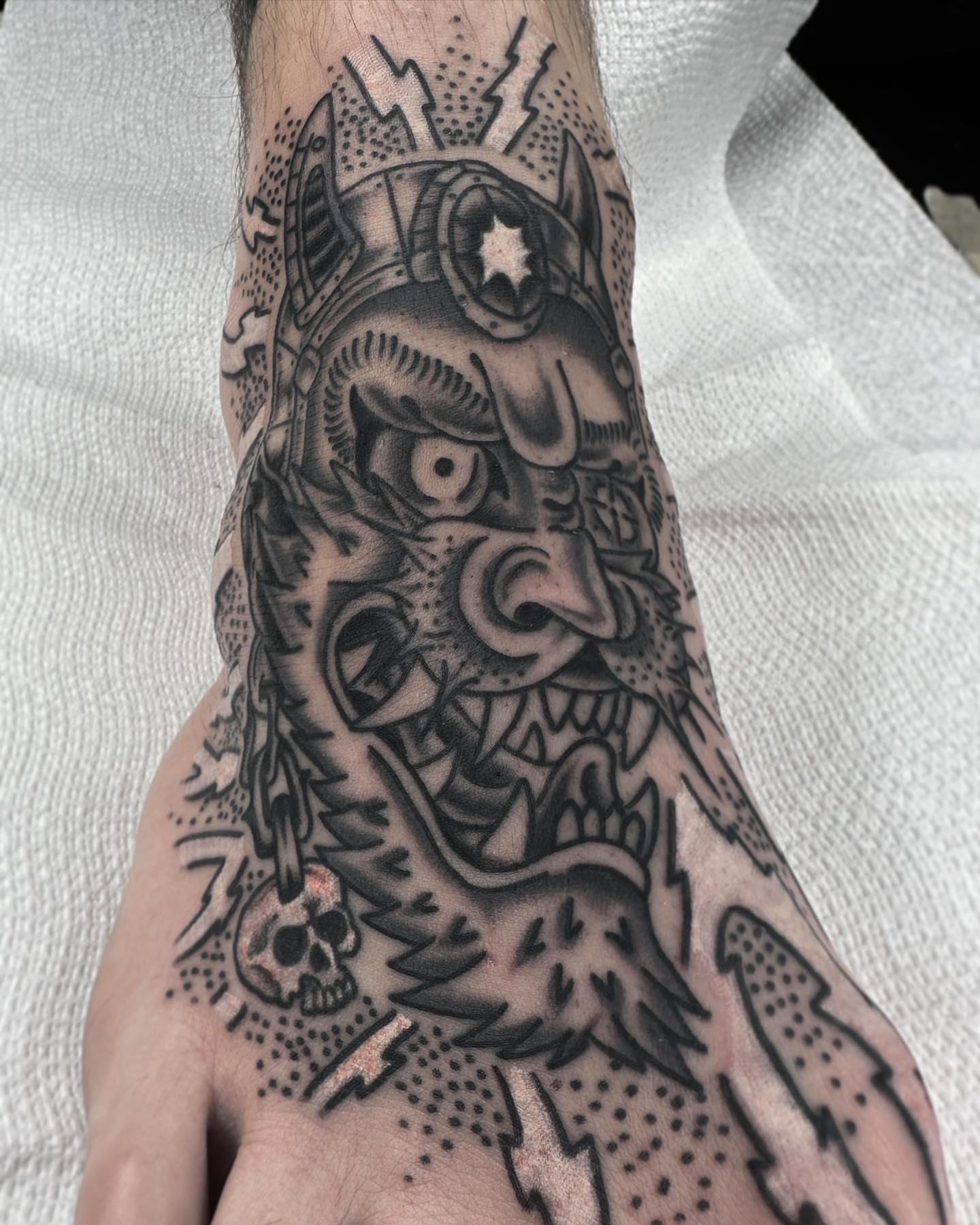 Demon skull American traditional tattoo on the hand by Elijah Edwards