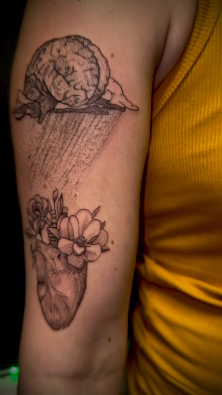 Snail and anatomical heart with flowers fine line tattoo by Tim Faulkner