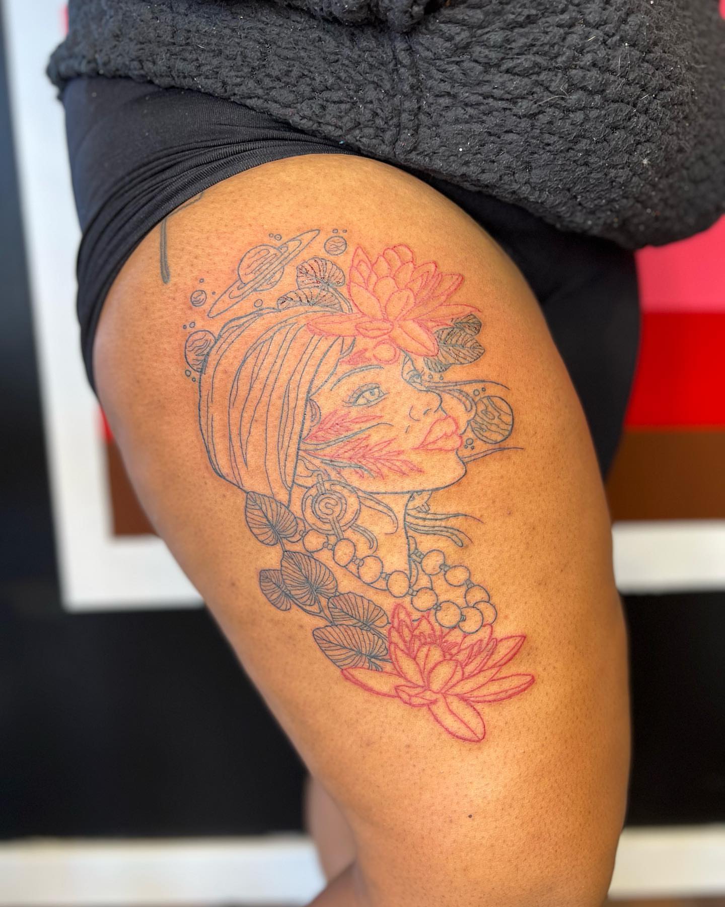 Woman with lotus flowers fine line tattoo on the thigh by ✨BADJASS the tattoo artist✨