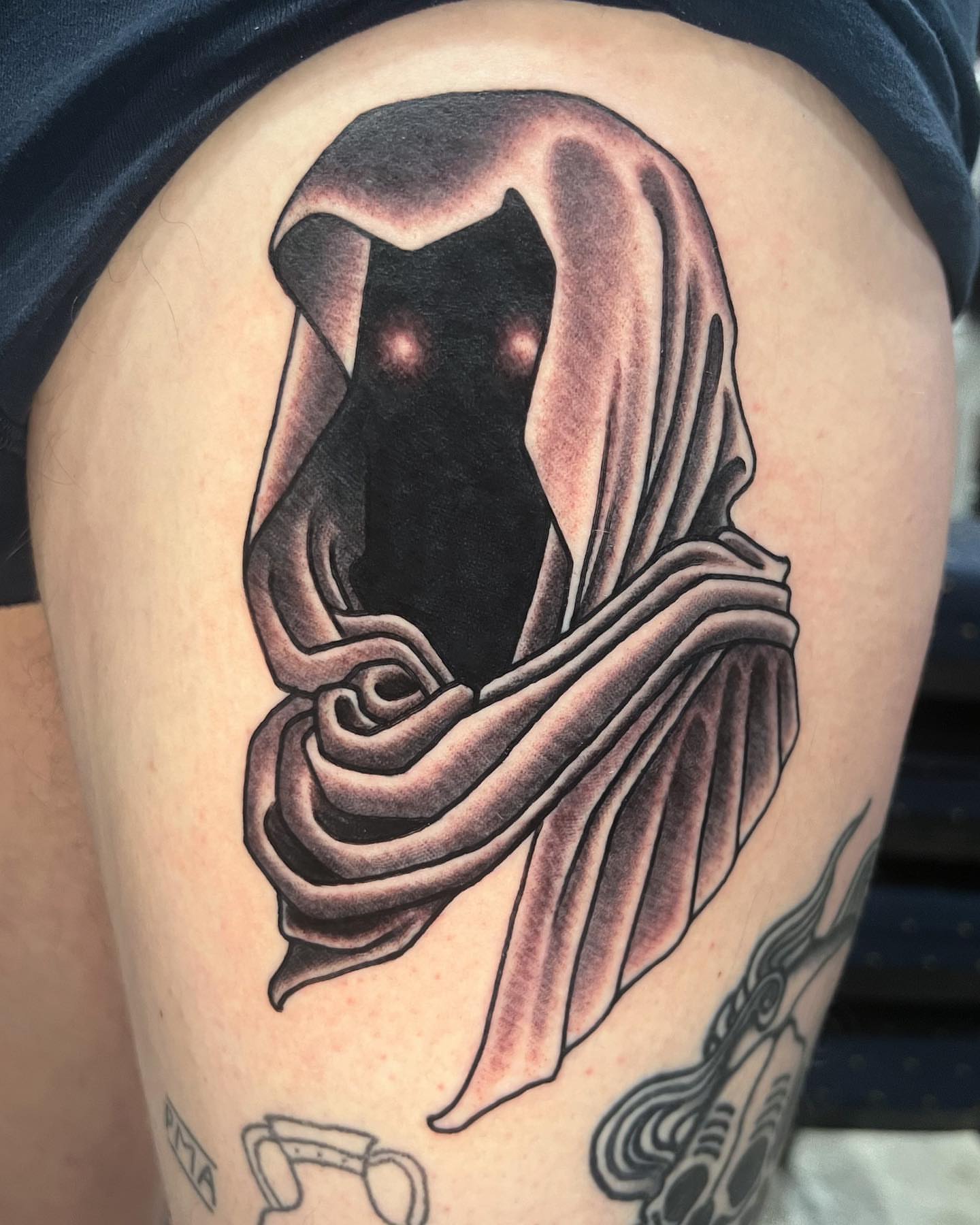 Hooded figure black and grey tattoo on the thigh by ๐ฎ๐๐๐ ๐ญ๐๐๐