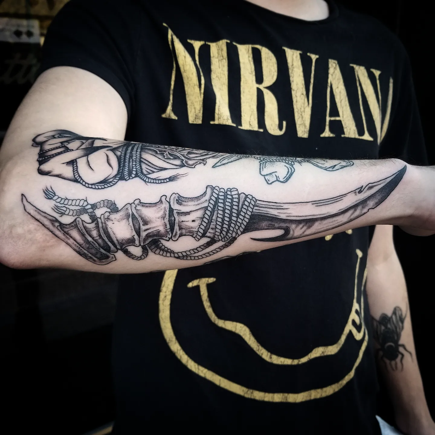 Knife black and grey tattoo on the forearm by Krista Mc