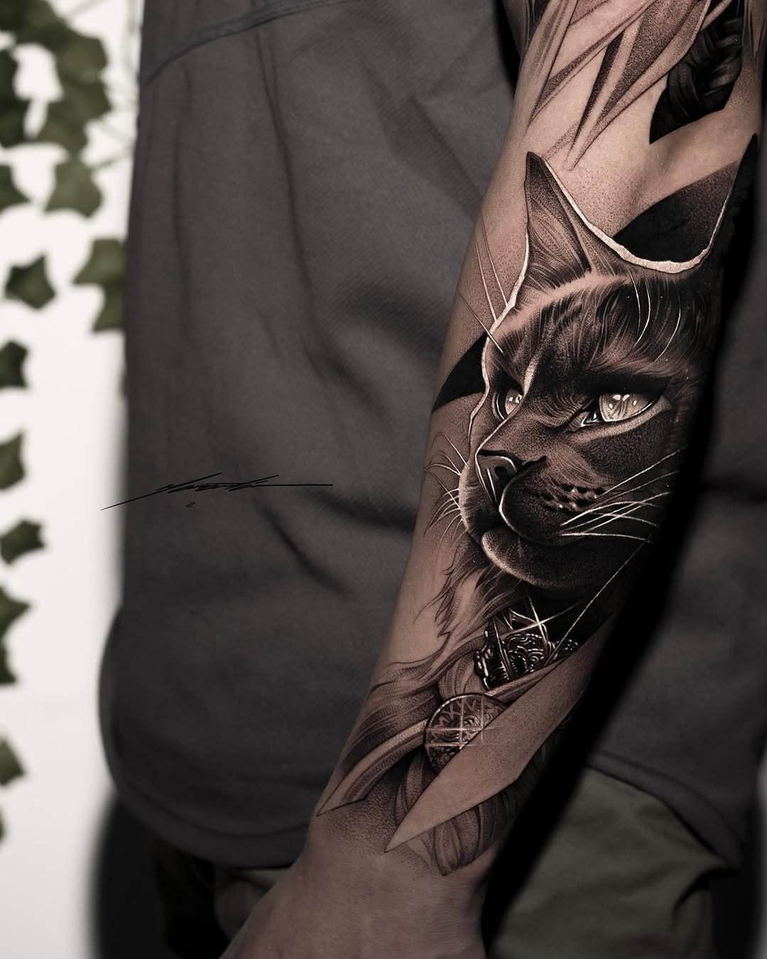 Cat portrait with ornamental details realism tattoo on the forearm by Ke$la
