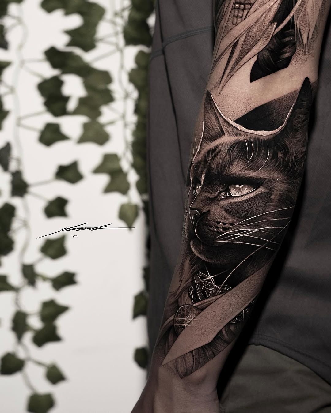 Cat portrait with ornamental elements realism tattoo on the forearm by Ke$la