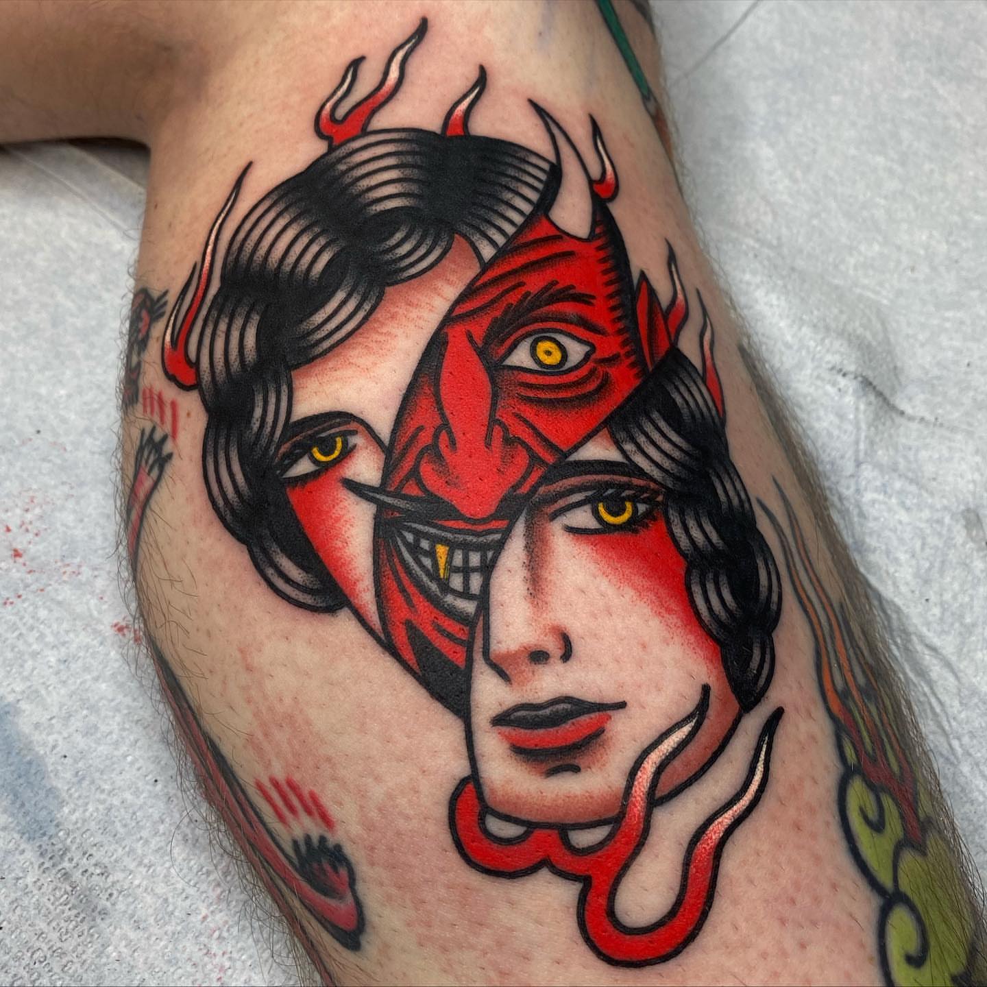 Demon and woman American traditional tattoo on the thigh by andrewtattoos